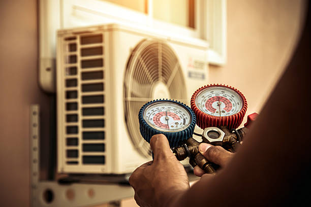 Professional Air Conditioning Service technician working in Butler, AL